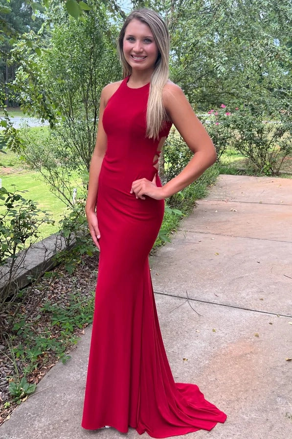 Front view of a Loverlm red jersey mermaid evening dress with a halter neckline, sleeveless design, side cutouts, fitted silhouette, and sweeping train.