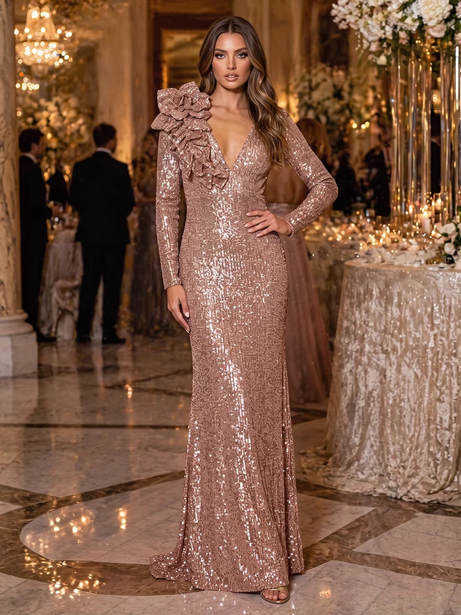 Rose gold sequin sheath evening dress with plunging V-neckline, long sleeves, dramatic floral shoulder embellishments and floor-length skirt by Loverlm