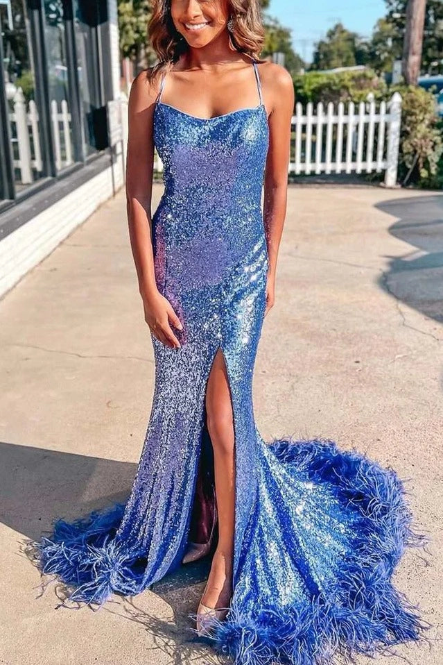 Front view of a Loverlm royal blue sequin mermaid prom dress with a square neckline, spaghetti straps, high slit, and feather-trimmed train.