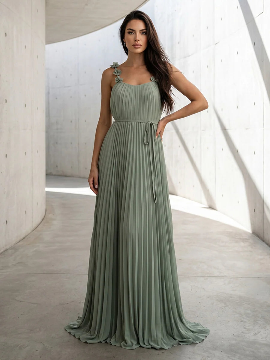 Sage green A-line chiffon bridesmaid dress featuring scoop neckline, floral spaghetti straps, pleated bodice, tie waist and flowing floor-length skirt by Loverlm