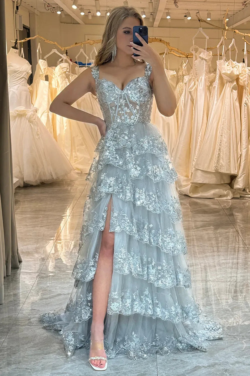 Loverlm silver blue prom dress front view with sweetheart neckline, sheer corset bodice, sparkling floral embellishments, front slit and tiered tulle skirt