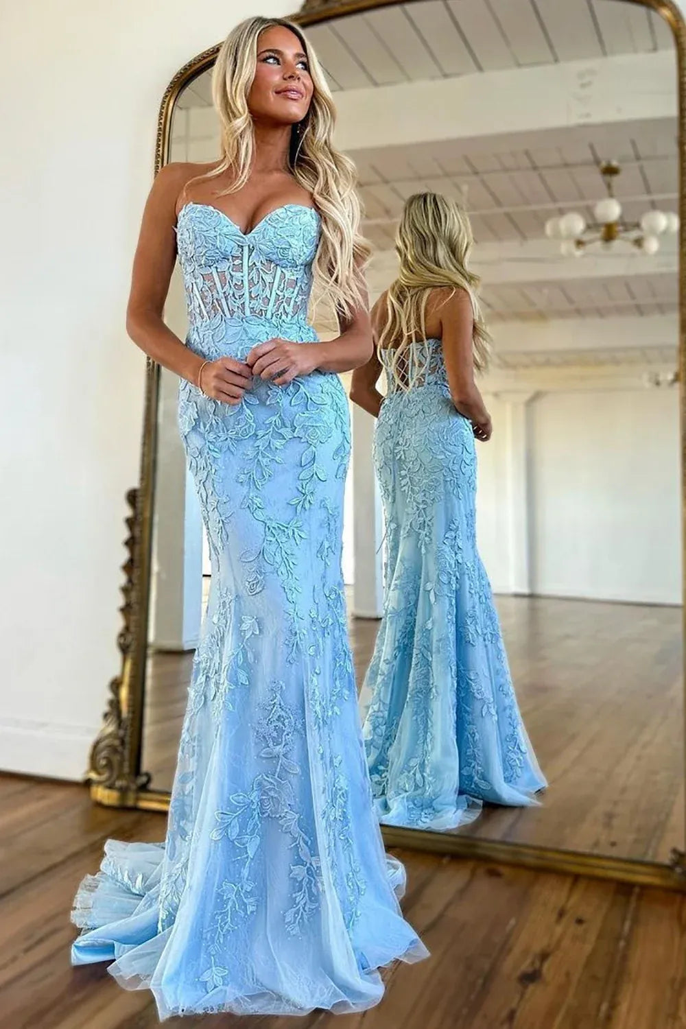 Front view of Loverlm sky blue mermaid prom dress with a strapless sweetheart neckline, sheer corset bodice and botanical lace appliques.