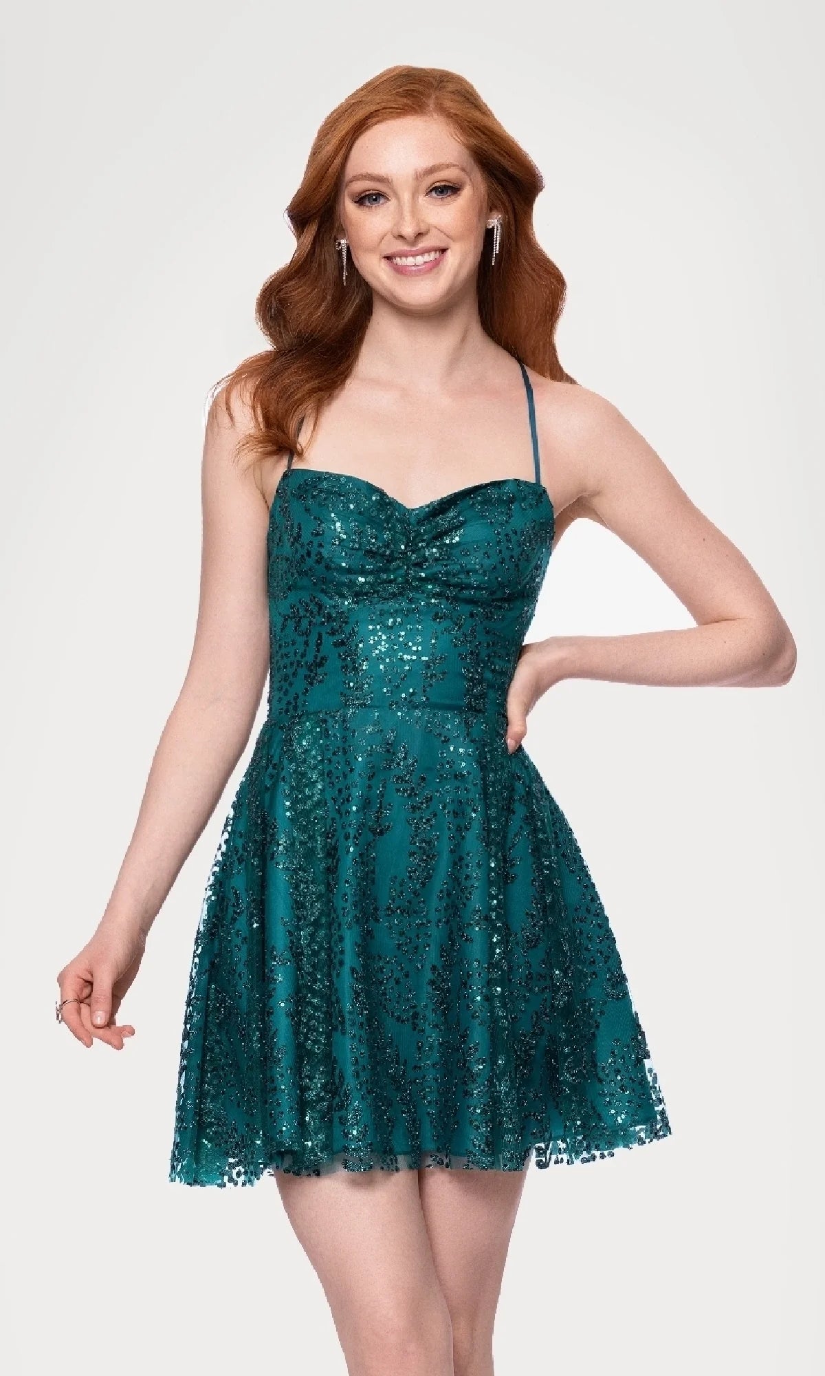 Teal blue sequin tulle mini homecoming dress with sweetheart neckline, ruched bodice, spaghetti straps and short A-line skirt