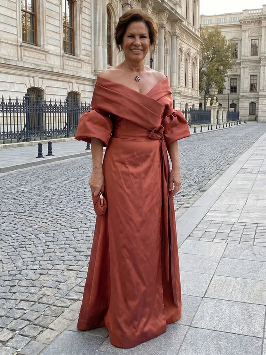 Loverlm terracotta Mother of the Bride dress with off-shoulder neckline puff sleeves wrap bodice waist sash and floor-length A-line skirt