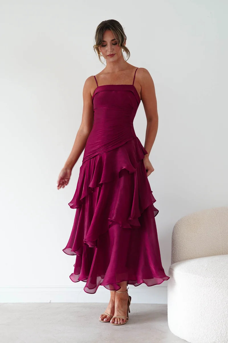 Loverlm wine red ruffled maxi wedding guest dress with straight neckline, spaghetti straps, diagonal waist ruching and asymmetric tiered skirt front view