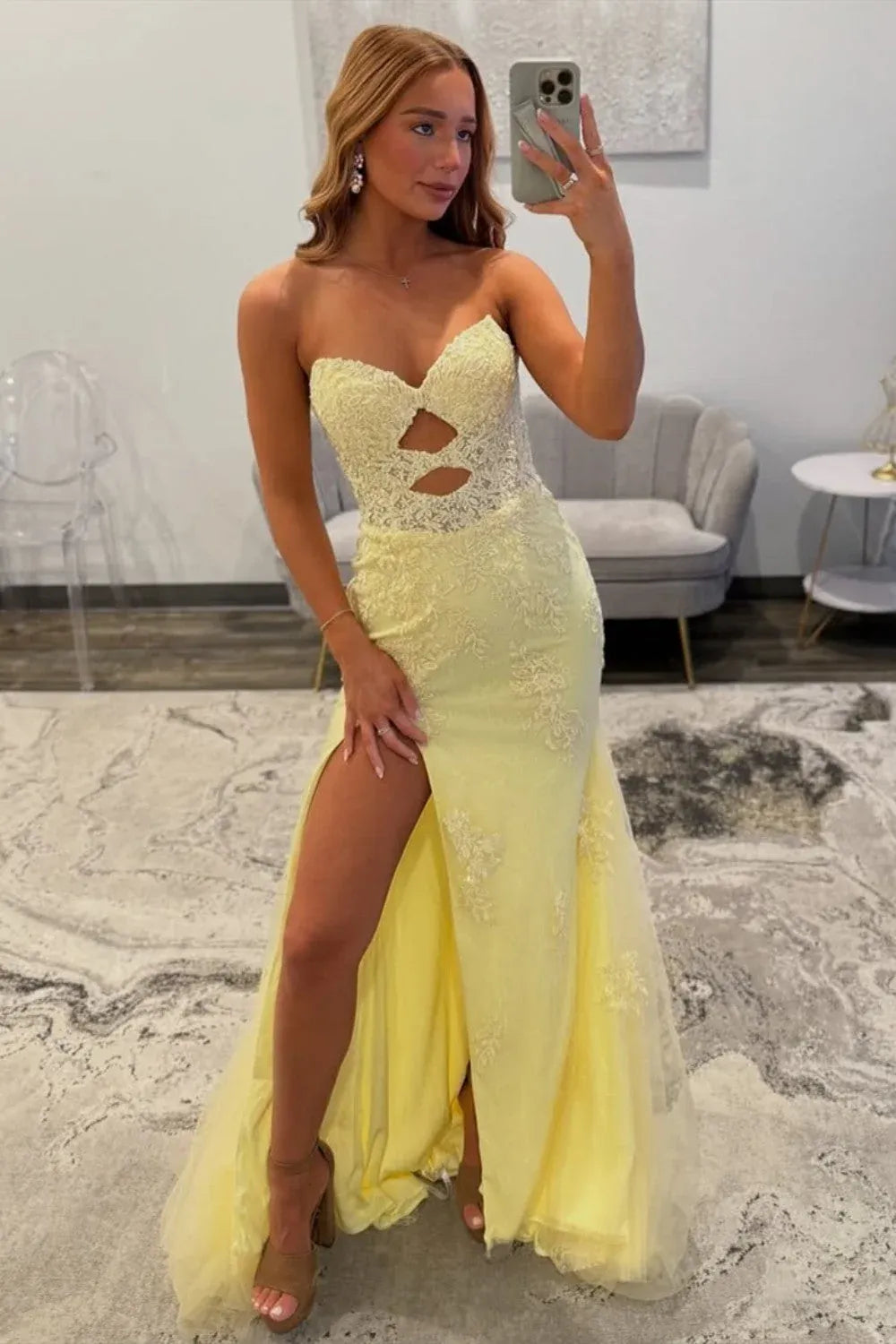 Loverlm light yellow lace mermaid prom dress with a strapless sweetheart neckline, two front cutouts, high slit and flared tulle hem.