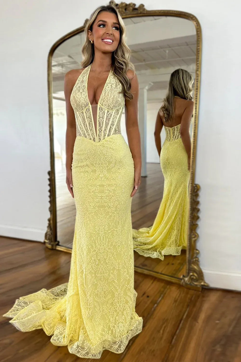 Loverlm yellow lace mermaid prom dress with a plunging halter neckline, sheer corset-style bodice and flowing lace train.